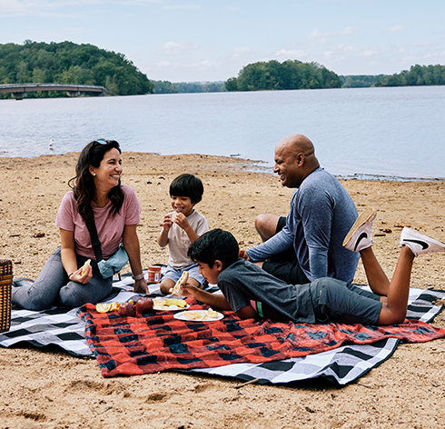 Family enjoying a picnic by the water in Baltimore County