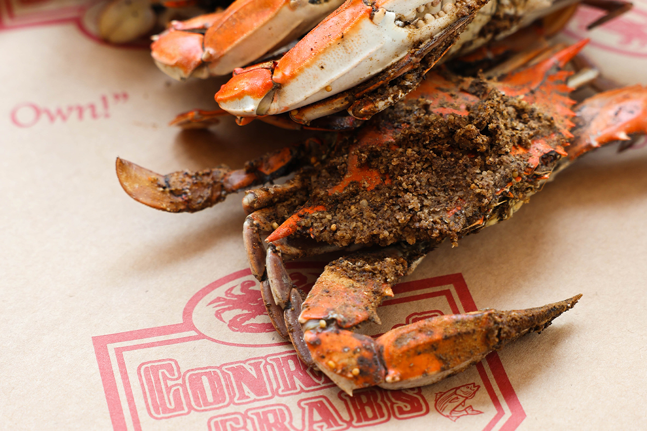 Crabs stacked on top of each other on brown paper