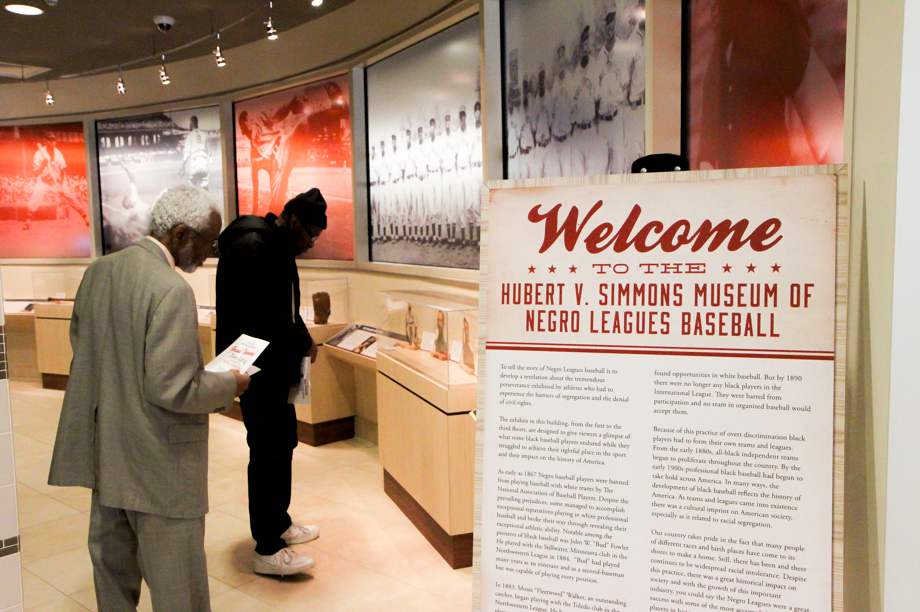 Two men reading displays in the Hubert V. Simmons Museum of Negro Leagues Baseball in Owings Mills, MD.